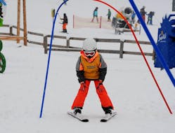 A kid having fun in the snow with Skischule Semmering during the Kids Ski Lessons "Bambini" (3-5y.) - Halfday.
