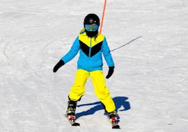 A kid going down the Semmering slopes during the Kids Ski Lessons (5-17 y.) for All Levels - Half Day with Skischule Semmering.