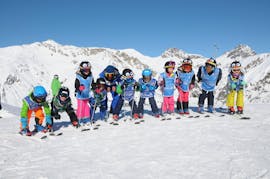Kids having fun in Livigno during one of the Kids Ski Lessons (4-14 y.) for All Levels - Full Day.