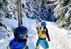 Kids in the woods during one of the kids ski lessons for all levels in Bellamonte.