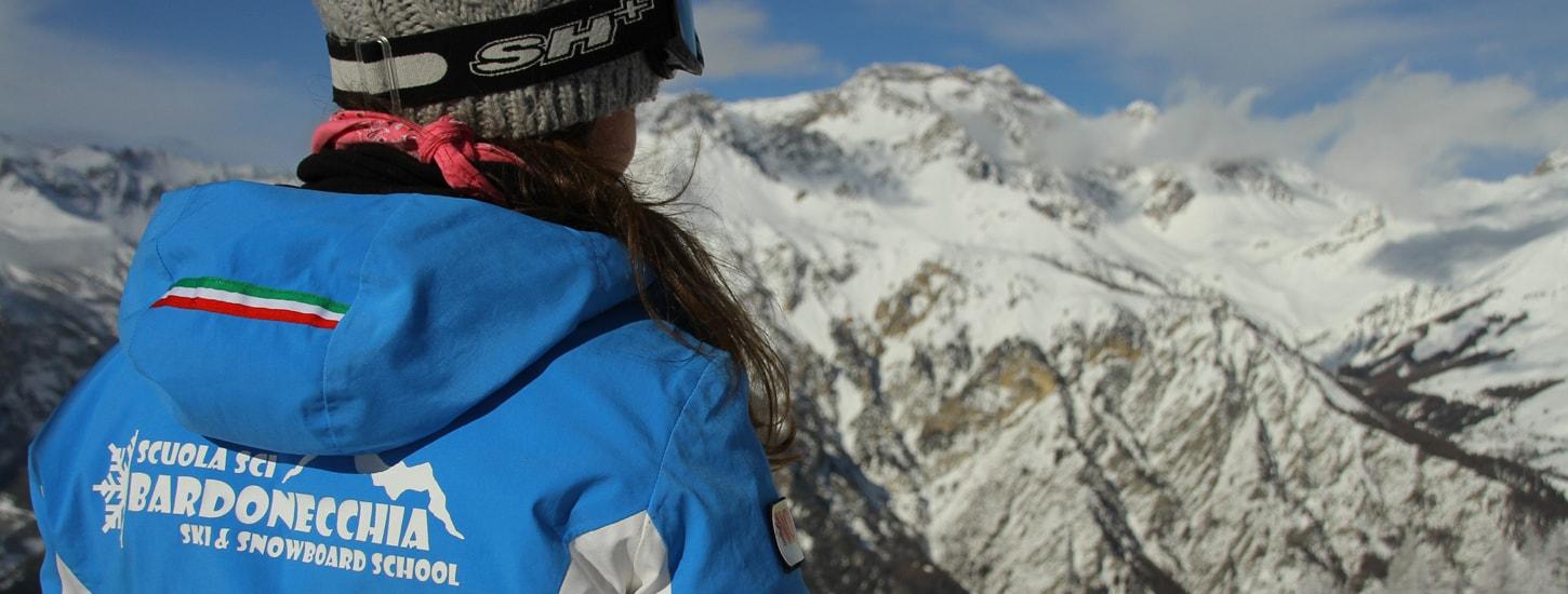 A ski instructor from the ski school Scuola di Sci Bardonecchia supervises the progress of his student during the Private Ski Lessons for Adults - Low Season. 