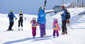 Two girls are taking part in the kids ski lessons "all in one" for all levels with skischool Neustift Olympia at Stubai glacier.