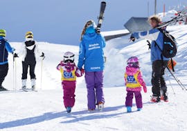 Two girls are taking part in the kids ski lessons "all in one" for all levels with skischool Neustift Olympia at Stubai glacier.