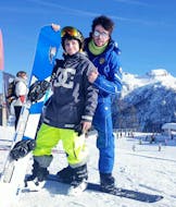 Sunny day in Folgarida during one of the private snowboarding lessons for kids and adults.