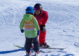 Kids Ski Lessons (3-7 y.) for Beginners - Half Day with Swiss Ski School Mundaun